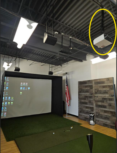 A room with a projector screen and a flag

AI-generated content may be incorrect.